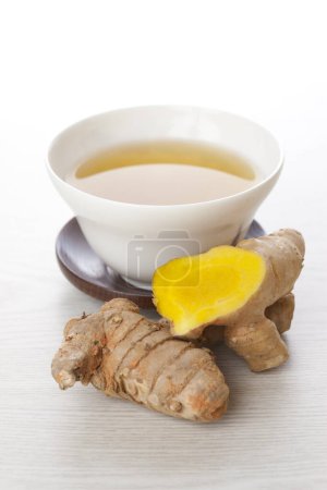 Photo for Turmeric root drink on white background close up - Royalty Free Image