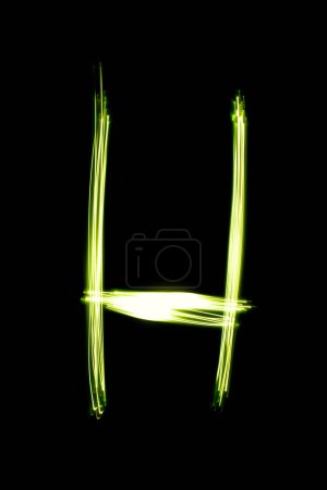 Foto de Luz pintura letra H sobre el fondo oscuro - Imagen libre de derechos