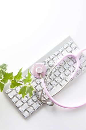 Photo for Keyboard And Pink Stethoscope - Royalty Free Image