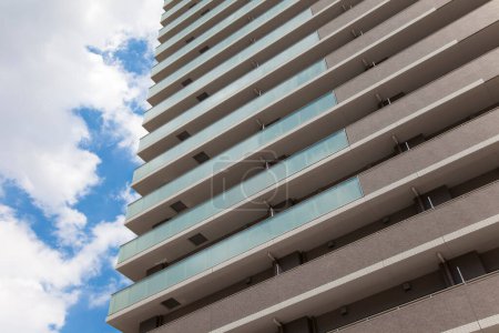 Photo for Building with balconies, windows and  blue sky - Royalty Free Image