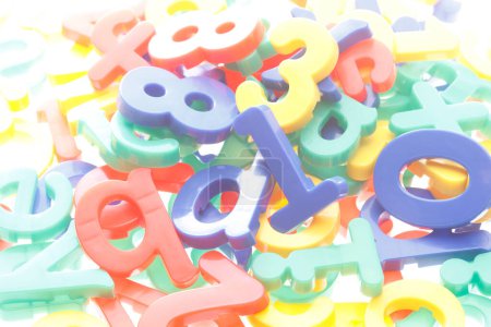 Photo for Letters and numbers made of plastic on a white background - Royalty Free Image