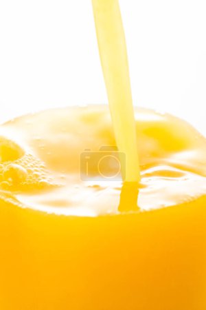 Photo for Fresh juice in glass on the table, closeup. - Royalty Free Image
