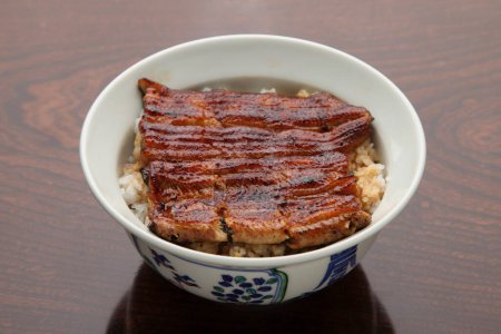 cuisine photo of Unadon, Grilled Eel Rice Bowl, a popular Japanese delicacy 