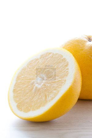 Photo for Fresh juicy lemons on light background - Royalty Free Image