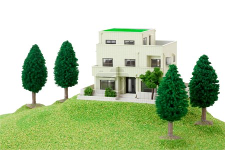 Photo for Modern house model with green grassy meadow - Royalty Free Image