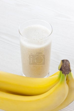 Photo for Milkshake with banana, healthy breakfast - Royalty Free Image