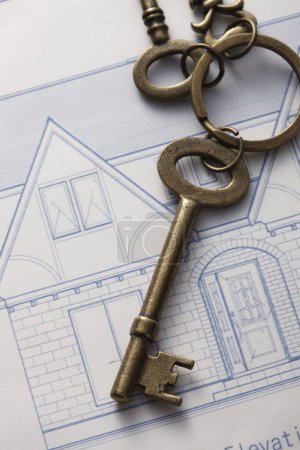 Photo for House keys on the background of blueprint, close-up view. - Royalty Free Image