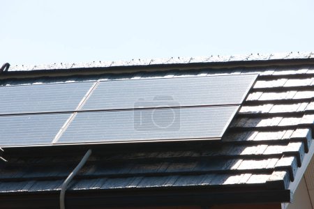 Photo for Solar panels on roof of building, alternative energy - Royalty Free Image