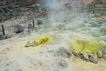 Photo for A yellow substance in the middle of a rocky area - Royalty Free Image