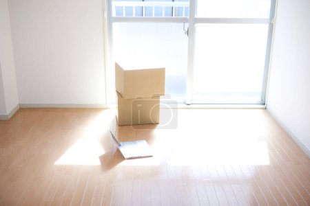 Photo for Empty cardboard boxes and laptop on floor - Royalty Free Image