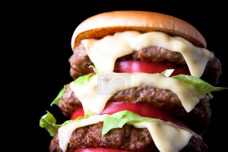 Photo for Close-up view of delicious fresh hamburger on black background - Royalty Free Image