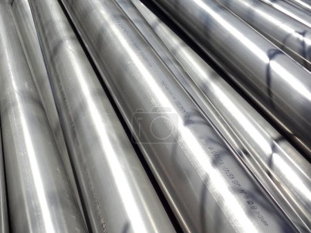 Photo for Metal profile pipes with round sections in the warehouse of metal and products - Royalty Free Image