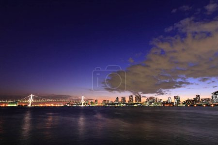 Photo for Modern buildings in the city in the evening with lights, urban background - Royalty Free Image