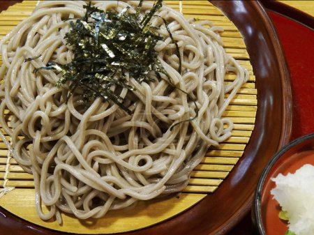 Photo for Japanese noodles with seaweed on background, close up - Royalty Free Image