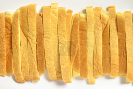 Photo for Sliced crunchy croutons on white background - Royalty Free Image