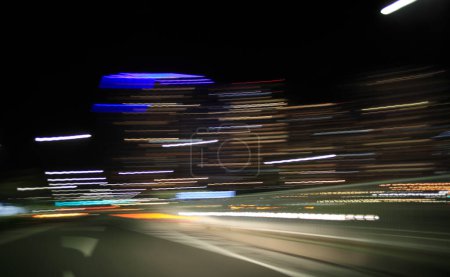 Photo for Motion blur view of car on night road and light trails, long exposure - Royalty Free Image