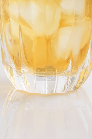 Photo for Close up view of glass of refreshing drink with ice cubes - Royalty Free Image