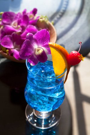 Photo for Close-up view of glass with fresh exotic tropical cocktail - Royalty Free Image