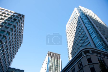 Photo for A city street with tall buildings - Royalty Free Image