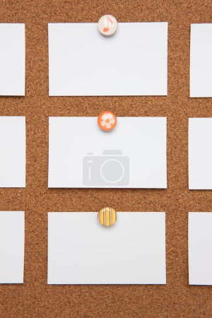 Photo for Blank business cards pinned on cork board, copy space - Royalty Free Image