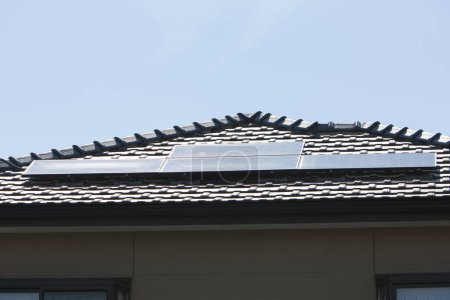 Photo for Solar panels on roof of building, alternative energy - Royalty Free Image