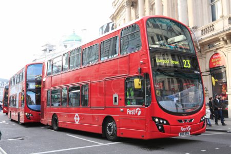 Photo for A red double decker bus driving down a street - Royalty Free Image