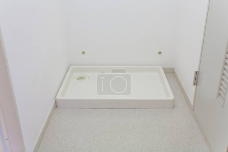 Photo for A white bathroom with a shower - Royalty Free Image
