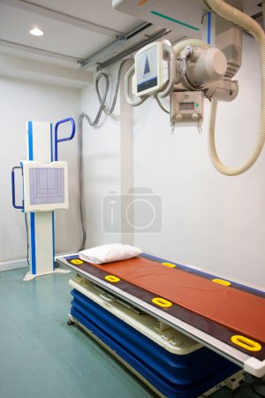 a hospital room with a bed  