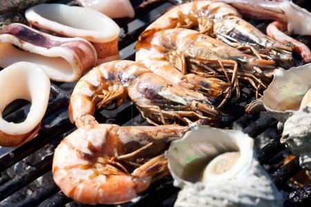 Photo for Delicious fresh seafood on grill, food background - Royalty Free Image