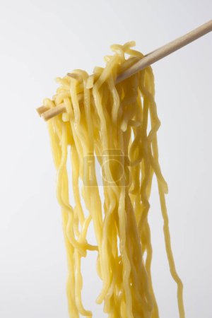 Photo for Asian noodles on chopsticks isolated on white background - Royalty Free Image