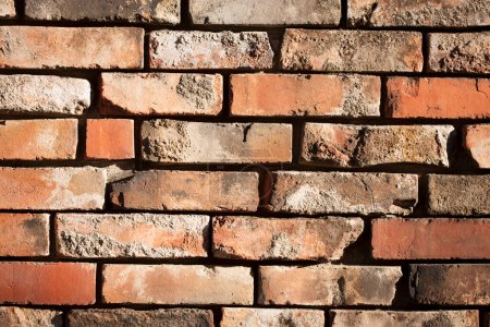 Téléchargez les photos : Vue rapprochée de la texture du mur de briques brunes - en image libre de droit