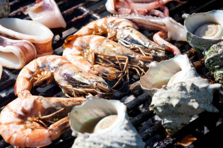 Photo for Delicious fresh seafood on grill, food background - Royalty Free Image