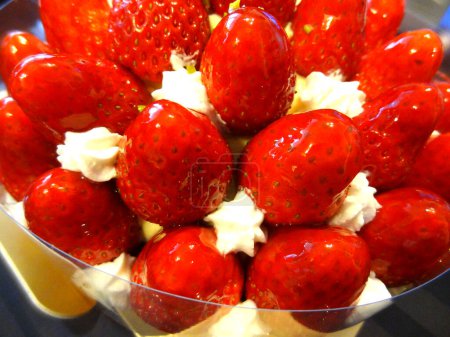Photo for Close-up view of delicious sweet dessert with strawberries and cream - Royalty Free Image