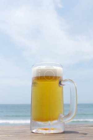 Photo for Glass of beer with foam on the table - Royalty Free Image