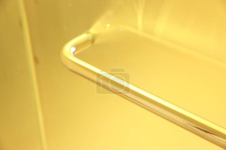 Photo for Metal handle of glass door in modern bathroom - Royalty Free Image