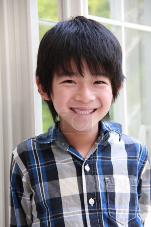 Photo for Portrait of a smiling Asian preteen boy - Royalty Free Image