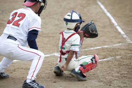 Photo for Japanese children playing baseball outdoor - Royalty Free Image