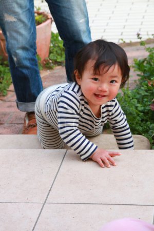 Photo for Portrait of cute asian baby boy in backyard - Royalty Free Image
