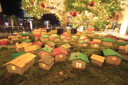 Photo for Christmas decoration with small wooden houses and lights - Royalty Free Image