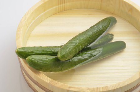 Photo for Cucumbers on the wooden bowl - Royalty Free Image
