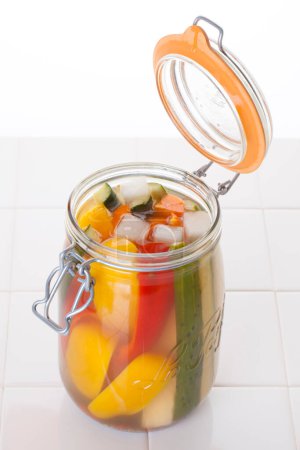 Photo for Glass jar with fresh vegetables and broth, cooking preparations - Royalty Free Image