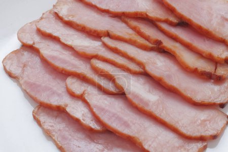 Photo for Closeup of thin slices of ham  on background - Royalty Free Image