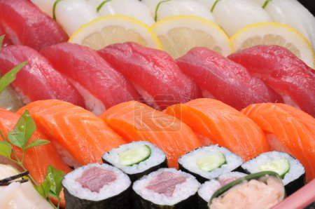 Photo for Sushi set with fresh salmon, tuna, shrimps - Royalty Free Image