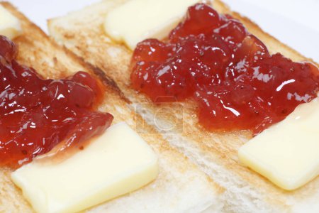 Photo for Toasts with butter and jam, close up view - Royalty Free Image