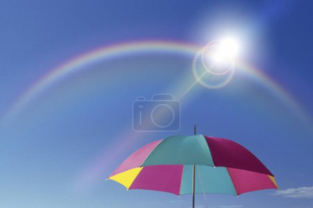 Photo for Rainbow umbrella in front of the sky - Royalty Free Image
