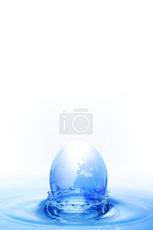 Photo for Blue globe on water surface - Royalty Free Image