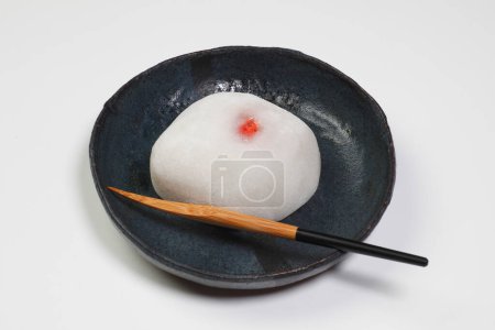 Japanese traditional confectionery cake wagashi on plate on white background