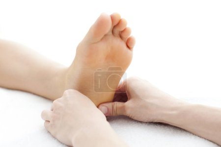 Photo for Woman getting foot massage at spa salon - Royalty Free Image