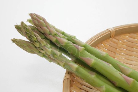 Photo for Fresh green asparagus isolated on background, close up - Royalty Free Image