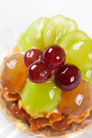 Photo for Dessert close up view with grapes on white - Royalty Free Image